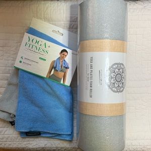 Two yoga and fitness, hand towels, and a yoga and Pilates foam roller